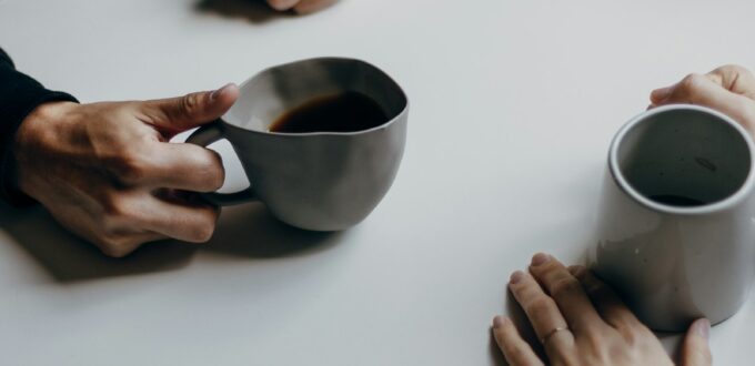 Couple sitting together over coffee, talking and connecting on a date