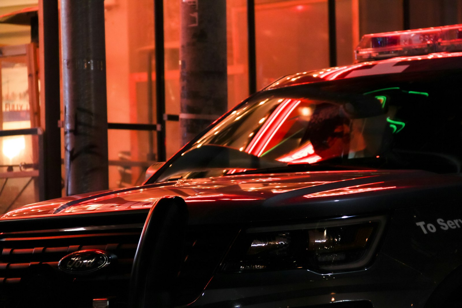 Police car at night, representing real honeypot robbery cases from dating apps