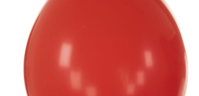 A single red balloon against the sky, evoking the pop-or-not moment at the center of the viral dating format